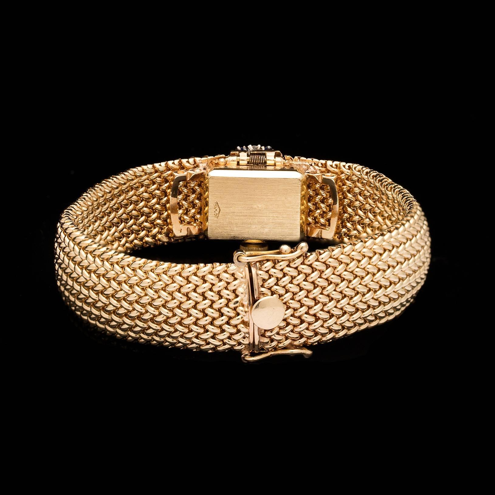 Women's Movado Lady's Yellow Gold Diamond Sapphire Hidden Dial Wristwatch