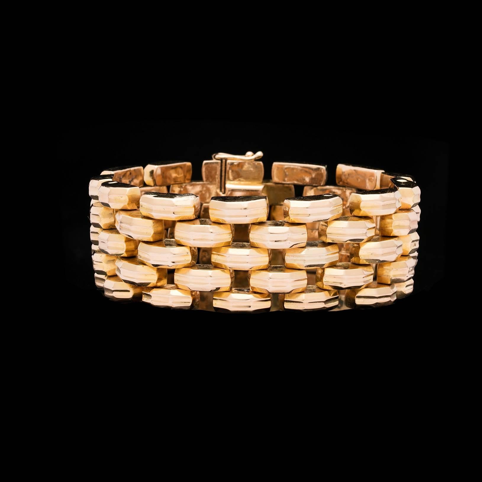 Vintage 18k yellow gold textured 5-row link bracelet measuring 1 inch wide and 8 1/4 inches long.  This piece totals 70.0 grams.