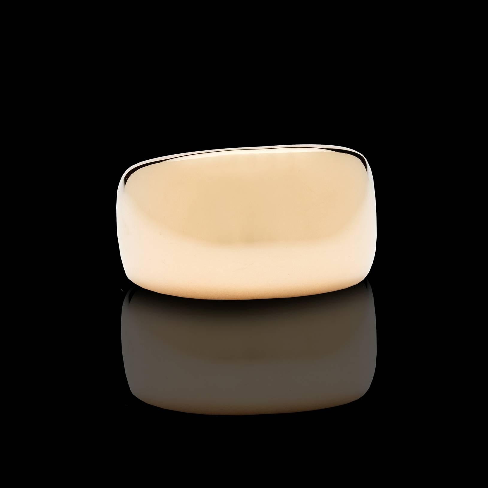 Bold Cartier Nouvelle Vague Ring in 18Kt Yellow Gold.   The ring measures 1/2