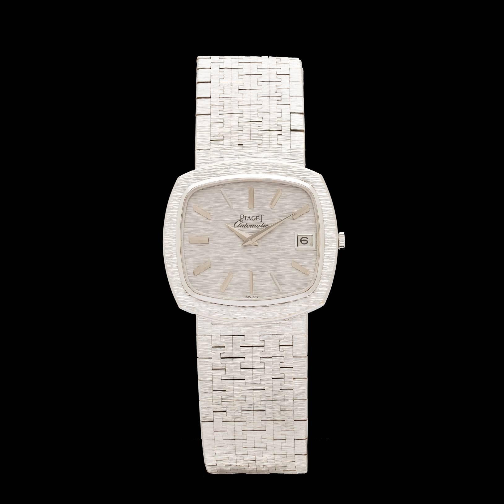 Piaget 18k white gold bracelet watch with a textured finish detail on the bracelet, case, and dial of the watch.  Case size is 32 mm, 8 inches long, with an automatic movement.  Model # 13431A6.  Total weight of the watch is 96.3 grams.