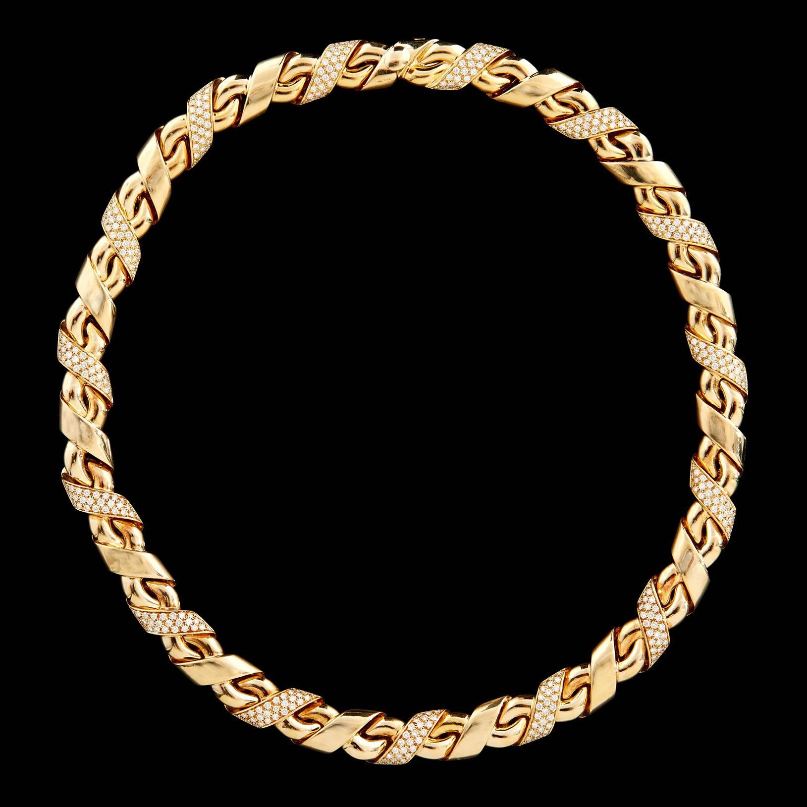 Chaumet 18K Yellow Gold Choker Ruban Style Necklace features a total of 405 E-F VS1 Round Brilliant Cut Diamonds totaling 4.50 Carats of Pavé Diamonds Alternating Between Links. The necklace is 16 inches in length, 9.5 mm wide, and weighs 90.3