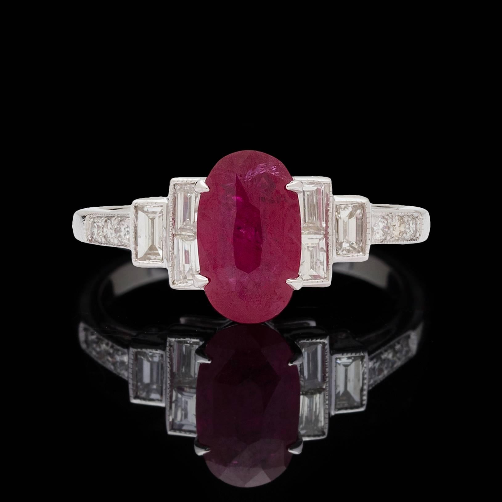 Stunning Deco style 18k white gold ring features a 1.97 carat Burmese pink sapphire detailed with baguette and round brilliant diamonds totaling 0.43 carats. Ring size is a 6.75 and can be resized. Total weight of the ring is 3.5 grams. 