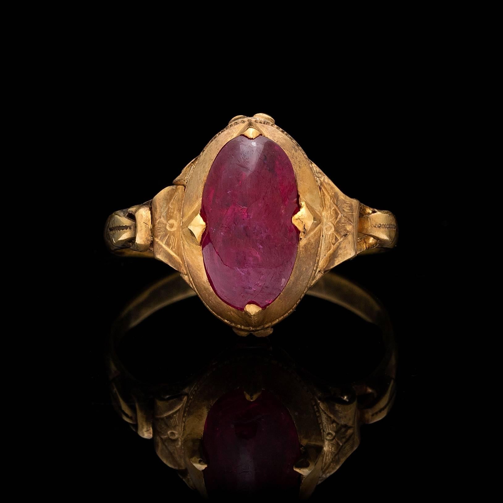 Vintage 14k yellow gold ring features a 2.18 carat cabochon unheated ruby measuring approximately 11.0 x 6.5mm. This unheated ruby is accompanied by a report # given as a lot, # 6152901185. Ring size is a 6.5 and can be resized. Total weight of the