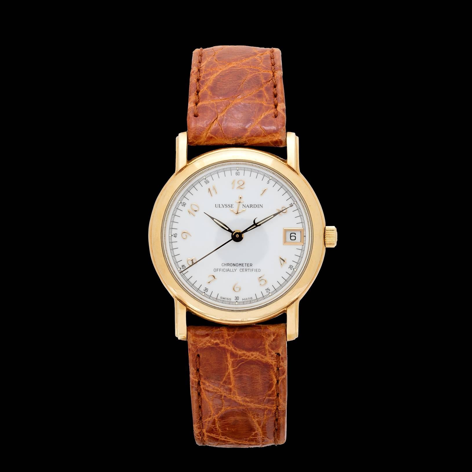 Since 1846, Ulysse Nardin watches have been inspired by the movement of the ocean. Featured is an Ulysse Nardin San Marco model 18k yellow gold watch on a brown crocodile leather strap and gold ardillon buckle. Swiss made chronometer automatic