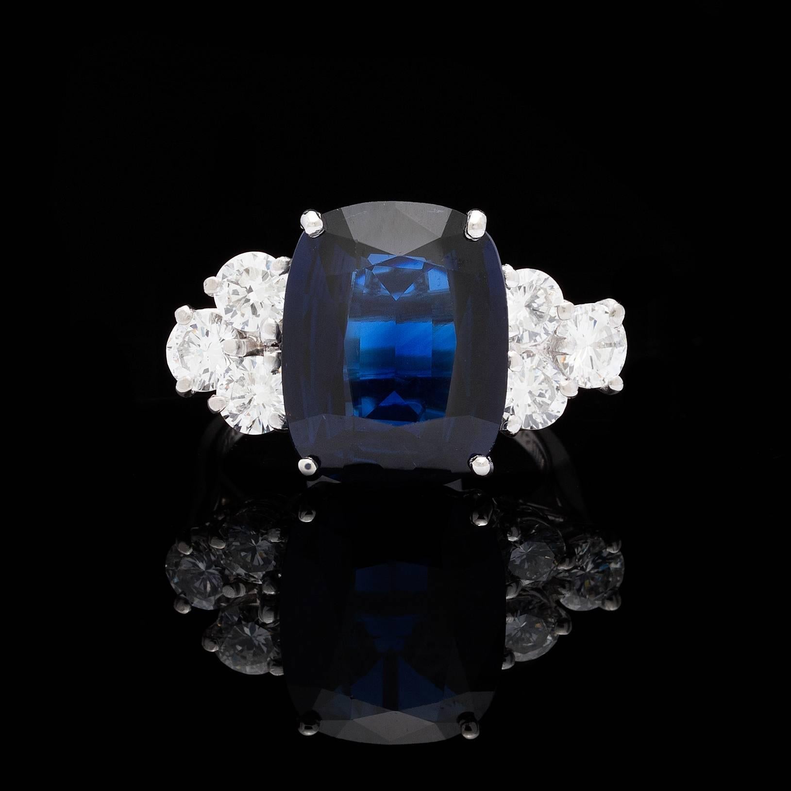 Fabulous cocktail platinum ring features a GIA 8.35 carat cushion shape mixed cut blue sapphire accented with 6 round brilliant diamonds totaling 1.32 carats. Ring size is a 4.5 and can be resized. Total weight of the ring is 8.3 grams. This ring