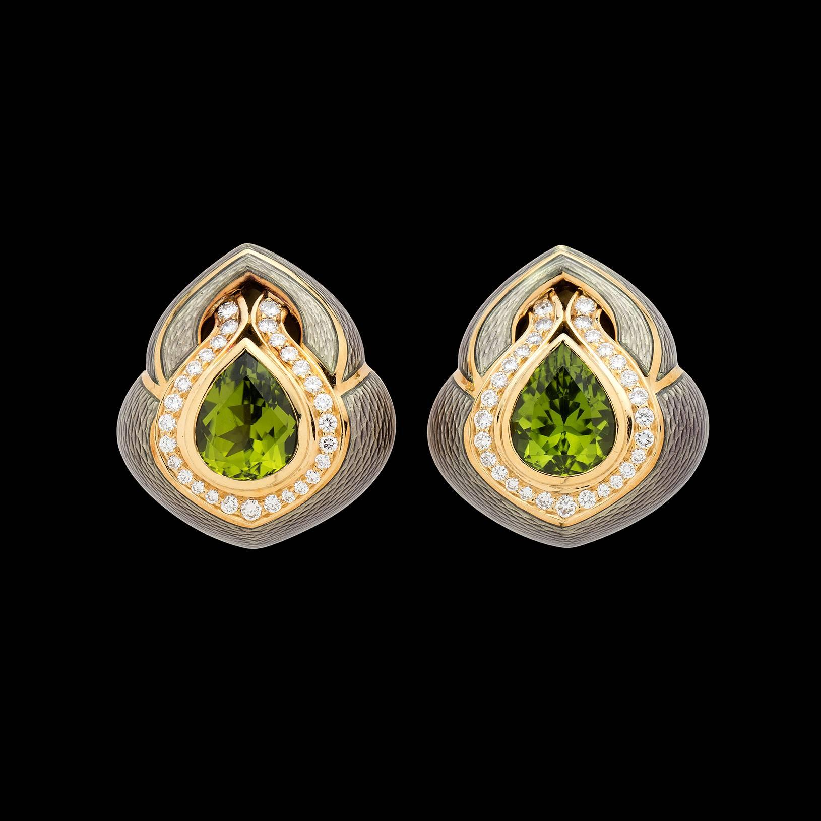 Estate De Vroomen clip earrings featuring two pear shape vivid green peridots, totaling approximately 7.00 carats, accentuated with 1.45 carat total weight round brilliant cut diamonds. Metallic enamel adds an interesting complement to the colors