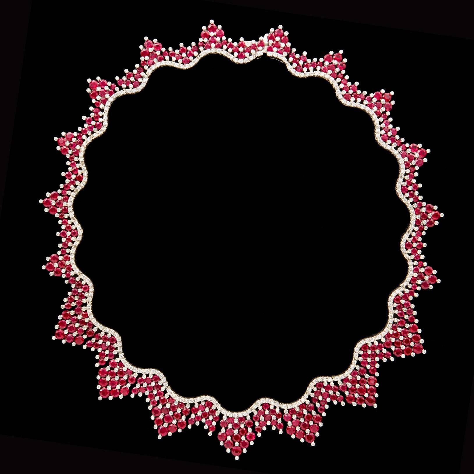 This Fabulous Favero Collar Necklace features 41.21 carats of Round Brilliant Cut Rubies accented with 5.60 carats of Round Brilliant Cut Diamonds set in 18Kt White Gold. Length is 16 inches and weighs 83.7 grams total.  This is a great accent piece!