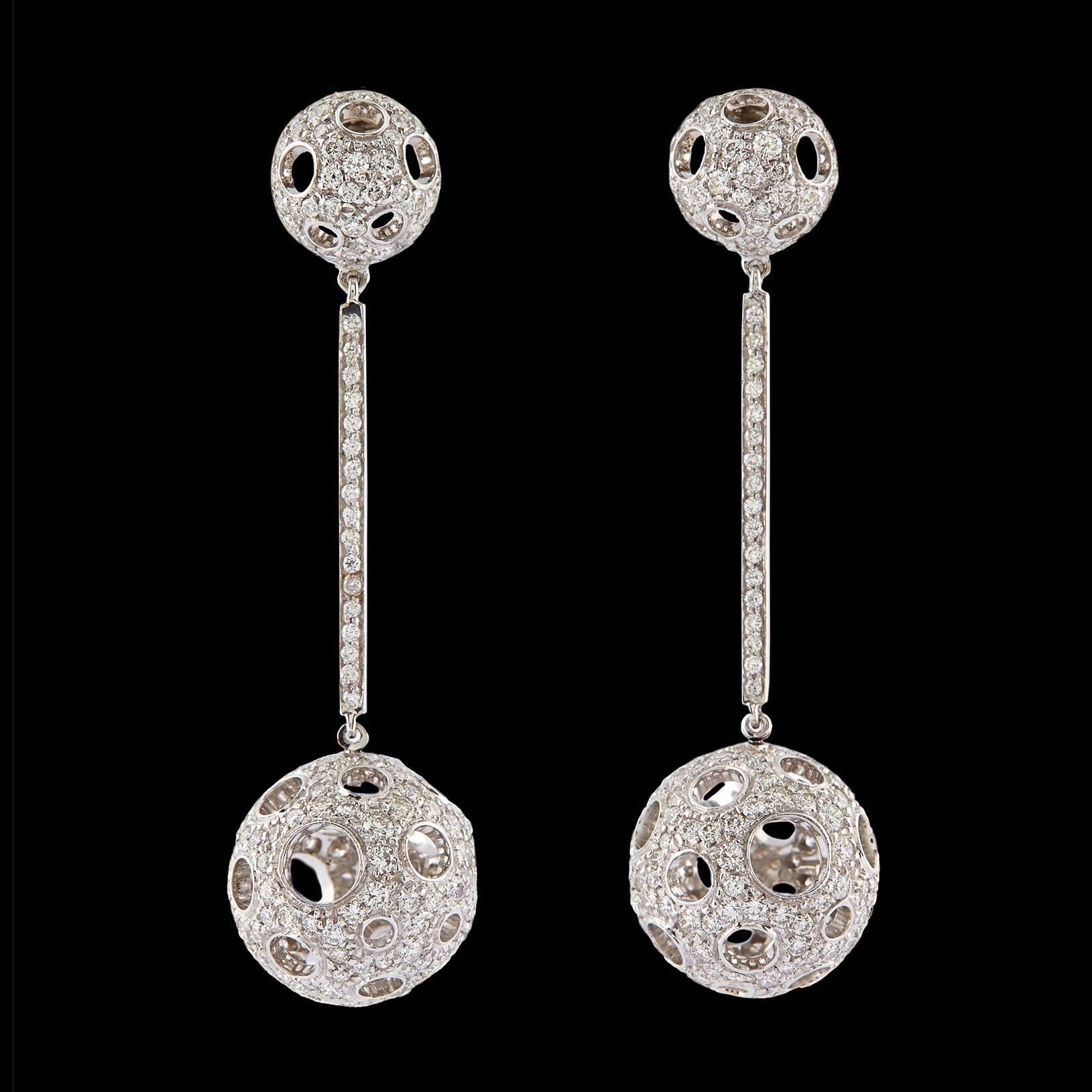 Luca Carati Dazzling Dangle Pave Diamond Ball Earrings totaling 4.27 carats set in 18Kt White Gold. The total length of each earring is 2 2/16″, the small ball at the earring post end is 7/16″ wide, separated by a 1″ bar between the larger ball