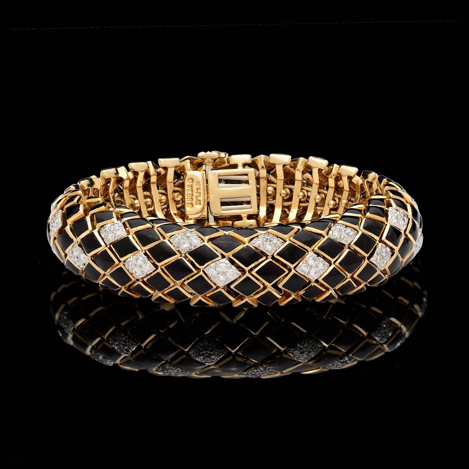 A rare David Webb flexible black enamel bracelet accented with 96 round brilliant cut diamonds totaling 2.40 carats.  This gorgeous piece measures approximately 7