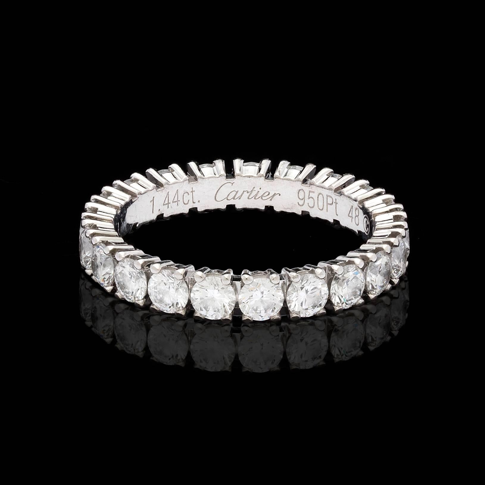 Classic Cartier diamond platinum eternity band totaling 1.44 carats of prong-set round brilliant-cut E-F/VS1 quality diamonds.  The ring is size 4.25 and measures 3mm wide.  A timeless stunning jewelry piece for all occasions. 
With Swiss hallmark.