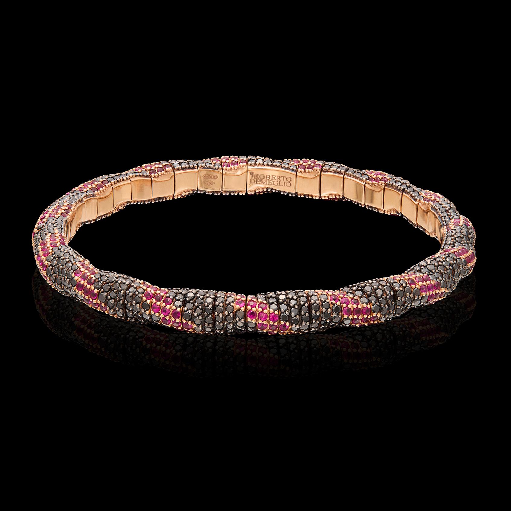 Fun and colorful, this 18k rose gold bracelet is a fun addition to your jewelry collection! Unique among Demeglio's stretch bracelets, this one is designed with diagonal sections of round black diamonds weighing 4.72 carats, alternating with round
