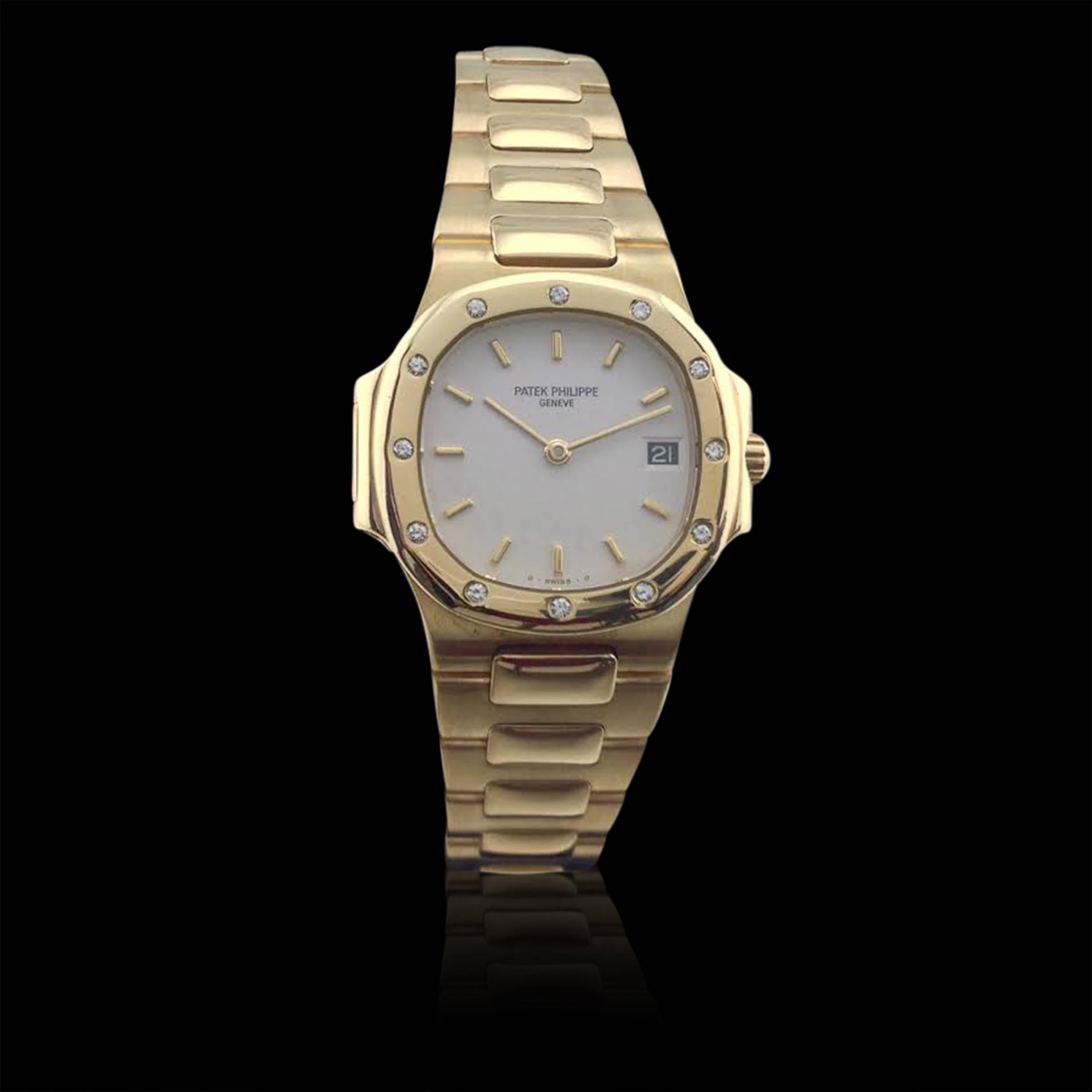 From Patek Philippe, one of the first names in luxury timepieces, comes the ladies 18k yellow gold Nautilus watch with diamond-set bezel. Featuring a white dial, bar chapters and date, this 27mm beauty is a timeless classic. The watch fits a 8 1/4