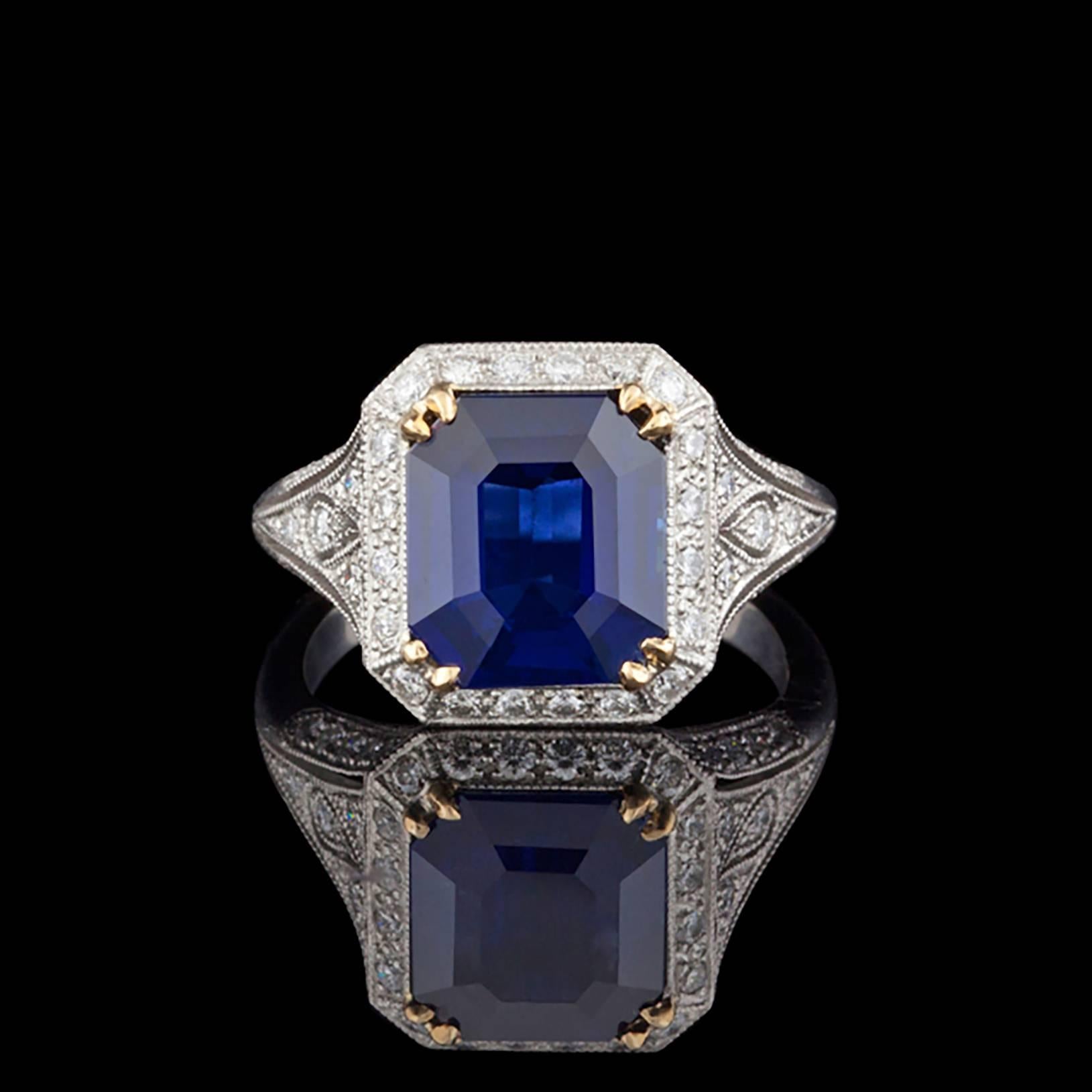 Fabulous platinum ring by French designer Sebastien Barier features one Octagonal Emerald Cut Natural Blue Sapphire for a total weight of 4.31cts accented by approximately 0.68cts of Round Brilliant Cut Diamonds. The total weight of this exquisite