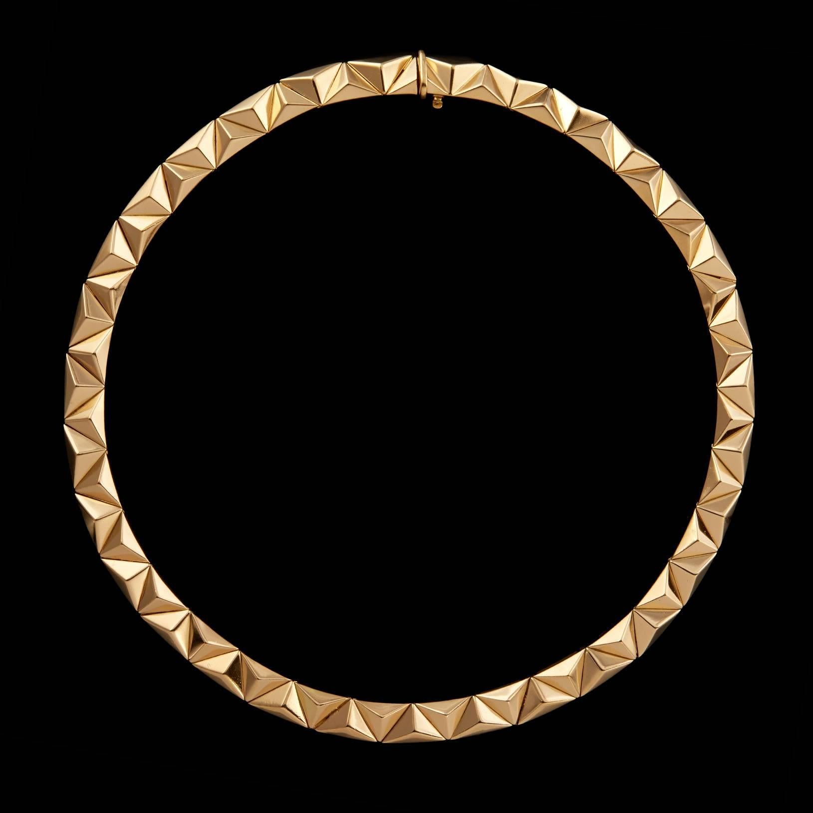 Bulgari 18Kt Yellow Gold Raised Triangular Link Choker Necklace. This necklace is 15 inches in length and 7.5mm in width. The weight is 88.0 grams.