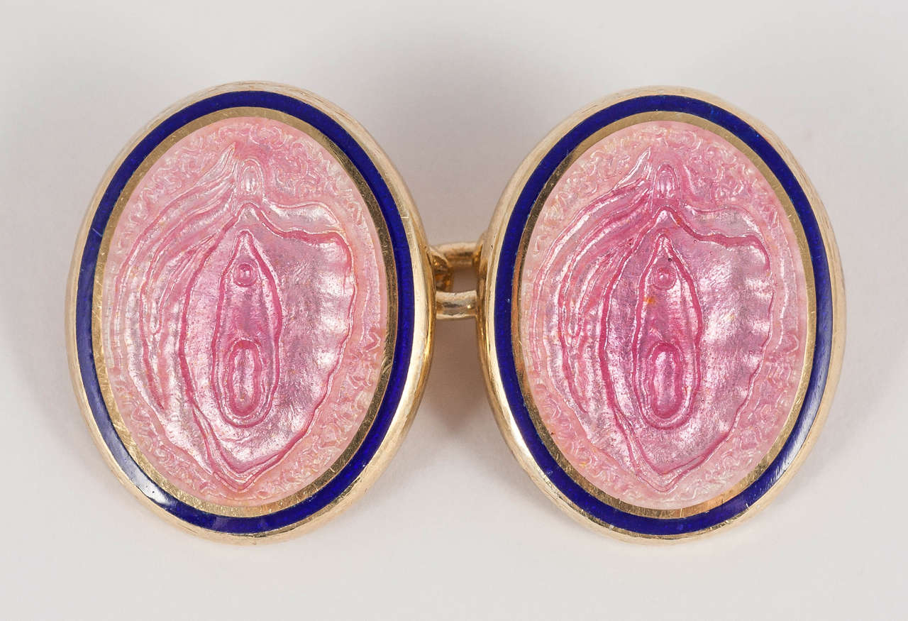 A pair of hand enamelled silver and 18 gilt vermeil cufflinks in rose pink with royal blue border. The motif is of the pudenda as it was referred to in the 18th century.