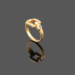 Elegant Cartier Ring Crafted in 18K Yellow Gold with Sapphires and Diamonds