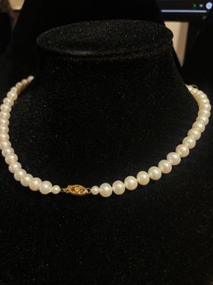 Collana classica con perle coltivate e chiusura in oro 14 carati