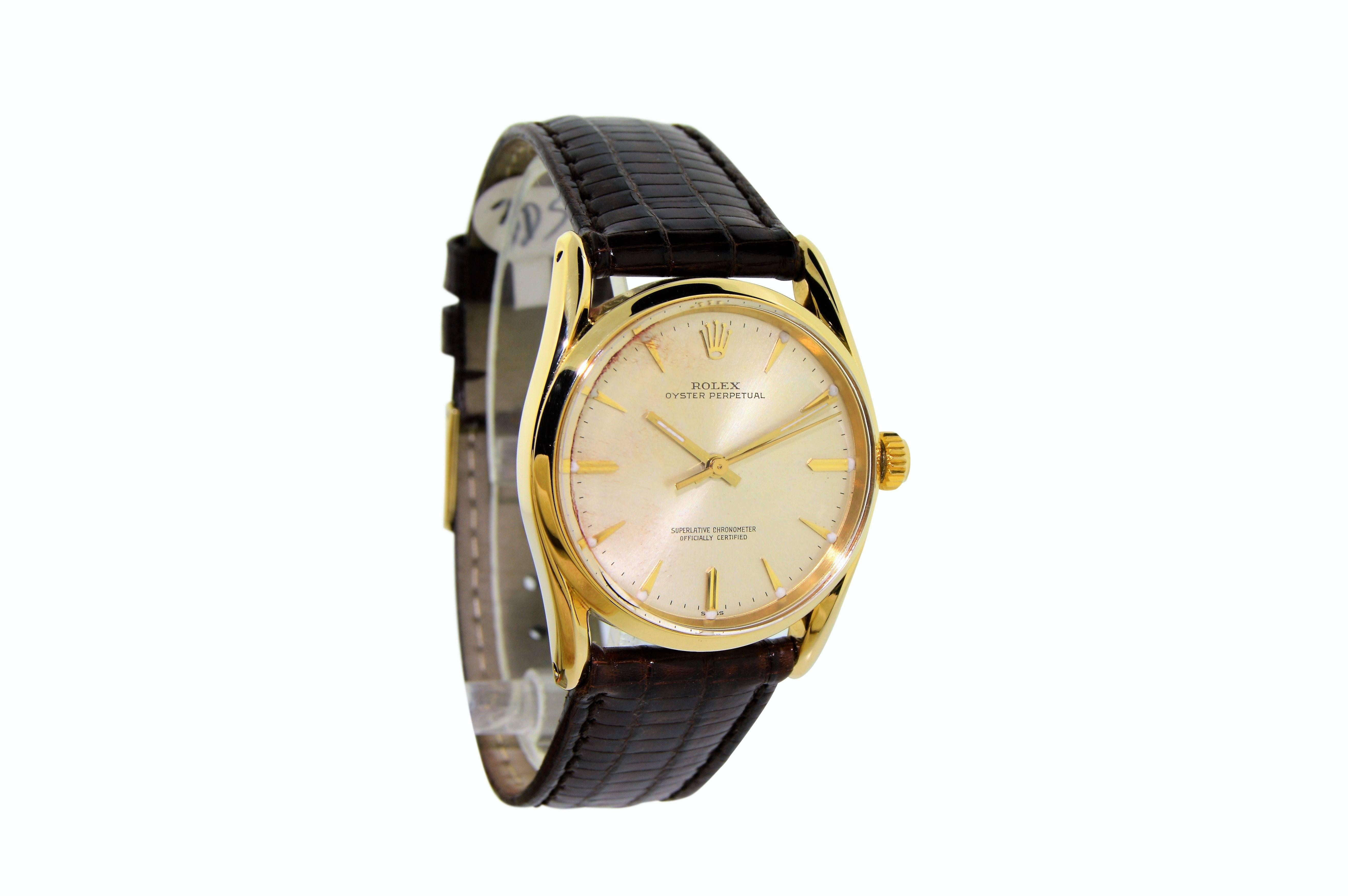 FACTORY / HOUSE: Rolex Watch Company
STYLE / REFERENCE: Oyster Perpetual / 60090
METAL / MATERIAL: 14Kt. Yellow Gold 
DIMENSIONS:  38mm  X  33mm
CIRCA: 1960's
MOVEMENT / CALIBER: 26 Jewels / Perpetual / Cal. 1560
DIAL / HANDS: Original Silver Batons