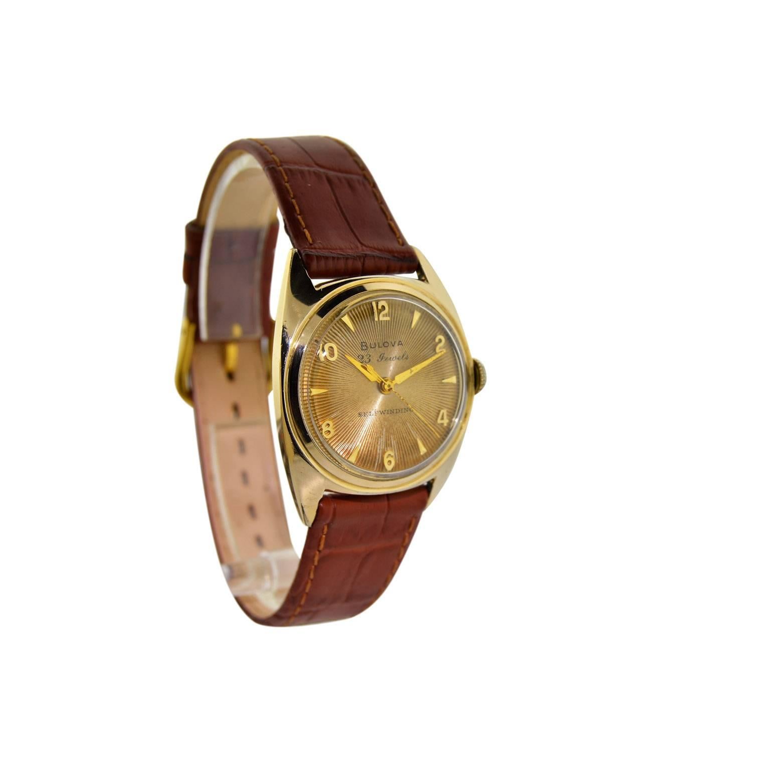 FACTORY / HOUSE: Bulova Watch Company
STYLE / REFERENCE: Art Deco / Round 
METAL / MATERIAL:  Yellow Gold Filled
DIMENSIONS:  39 mm X 32 mm
CIRCA: 1950
MOVEMENT / CALIBER: Automatic Winding / 23 Jewels 
DIAL / HANDS: Original Patinated Dial / Gilt