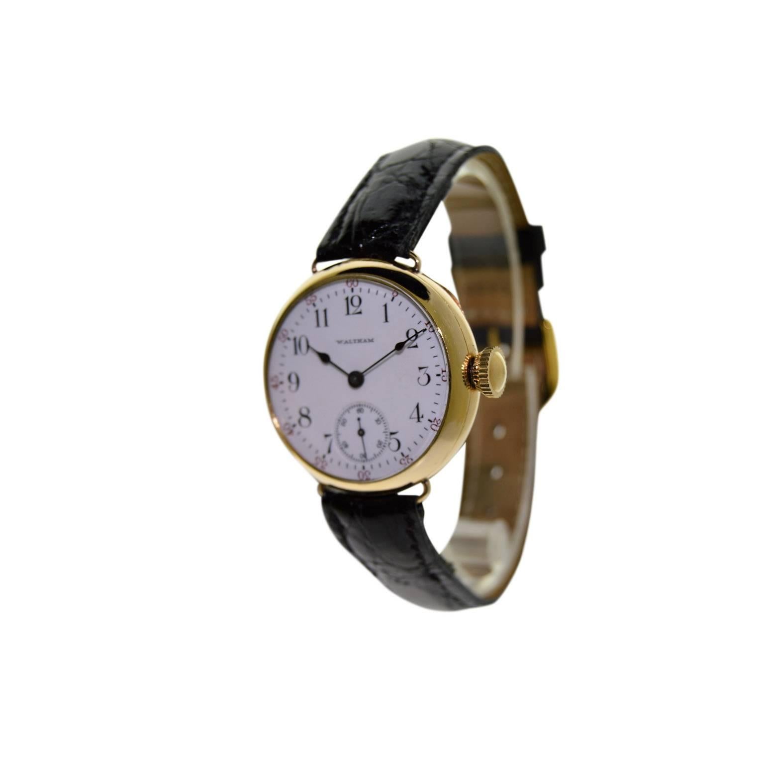 FACTORY / HOUSE: Waltham Watch Company
STYLE / REFERENCE: Military Campaign
METAL / MATERIAL: 14Kt. Yellow Gold Filled
CIRCA: 1908
DIMENSIONS: 36mm X 32mm
MOVEMENT / CALIBER: Manual Winding / 17 Jewels 
DIAL / HANDS: Original Kiln Fired Enamel with