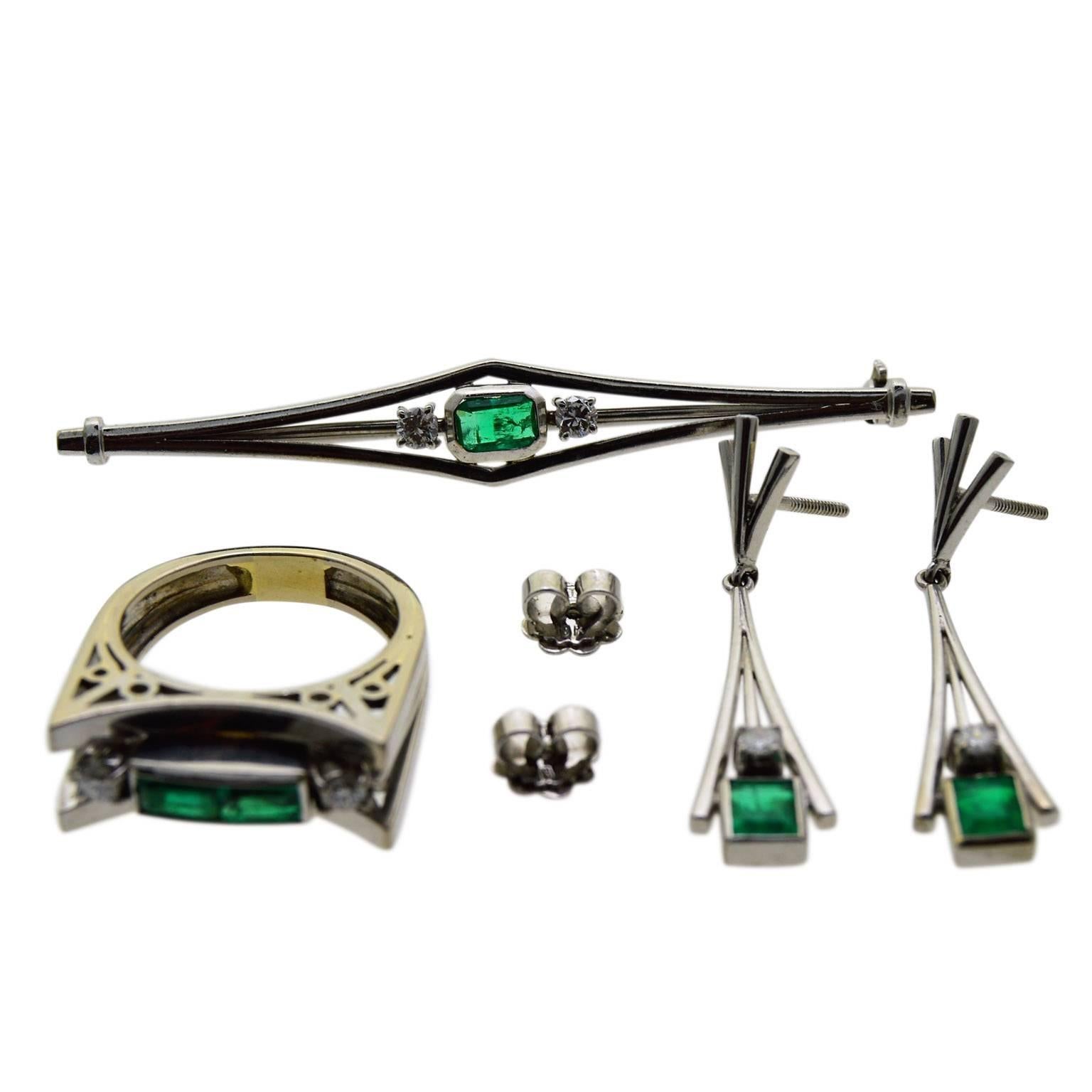 This unique set likely made in the 1930's is in exceptional condition. Each of the four items is entirely hand constructed in white gold.
Set with emeralds it comes with what seems to be an original box although it does not fit well in it. It