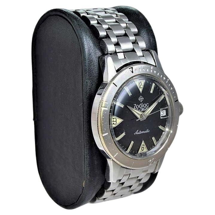 FACTORY / HOUSE: Zodiac
STYLE / REFERENCE: Diver
METAL / MATERIAL: Stainless Steel
CIRCA / YEAR: 1960's 
DIMENSIONS / SIZE: Length 43mm X Diameter 35mm
MOVEMENT / CALIBER: Manual Winding / 17 Jewels 
DIAL / HANDS: Black Original / Modified Dauphine