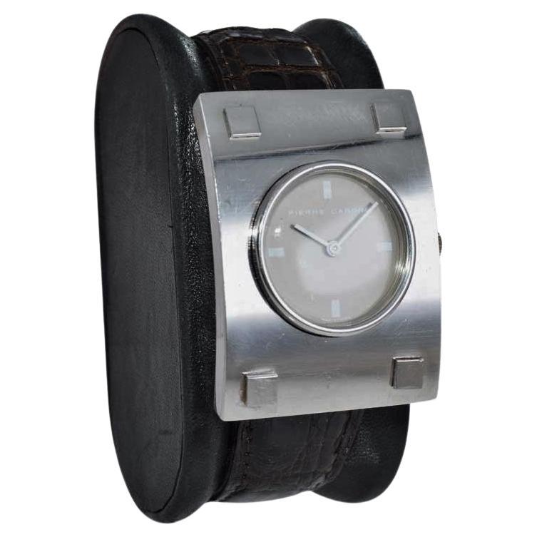 FACTORY / HOUSE: Pierre Cardin / Movement by Jaeger LeCoultre
STYLE / REFERENCE: Moderne 
METAL / MATERIAL: Stainless Steel 
DIMENSIONS: Length 42mm  X Diameter 30mm
CIRCA: 1970's
MOVEMENT / CALIBER: Manual Winding / 17 Jewels
DIAL / HANDS: Original