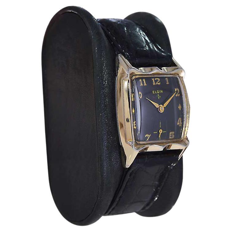 FACTORY / HOUSE: Elgin Watch Company
STYLE / REFERENCE: Tonneau Shape
METAL / MATERIAL: Yellow Gold Filled 
CIRCA / YEAR: 1940's
DIMENSIONS / SIZE: Length 34mm X Width 25mm
MOVEMENT / CALIBER: Manual Winding / 19 Jewels / Cal.732
DIAL / HANDS: Black