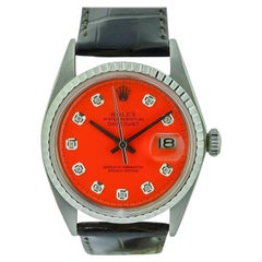 Orologio Rolex Datejust in acciaio inossidabile con quadrante arancione e diamanti, anni '70