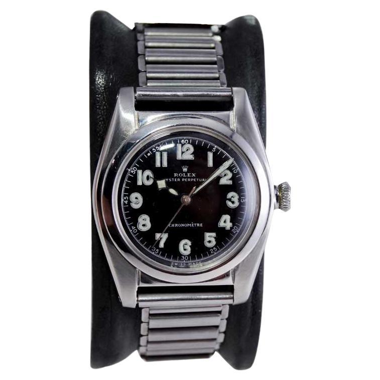 Rolex Montre chronomètre Bubbleback en acier inoxydable avec cadran noir, années 1940