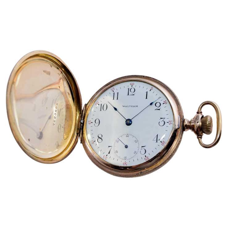 FACTORY / HOUSE: Waltham Watch Company
STYLE / REFERENCE: Hunters Case Pocket Watch / 16 Size / Hand Engraved
METAL / MATERIAL: Yellow Gold Filled
CIRCA / YEAR: 1906
DIMENSIONS / SIZE:  Diameter 49mm 
MOVEMENT / CALIBER: Manual Winding  
DIAL /