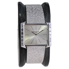 Patek in oro bianco 18kt con bracciale originale di fabbrica e lunetta con diamanti, circa anni '60