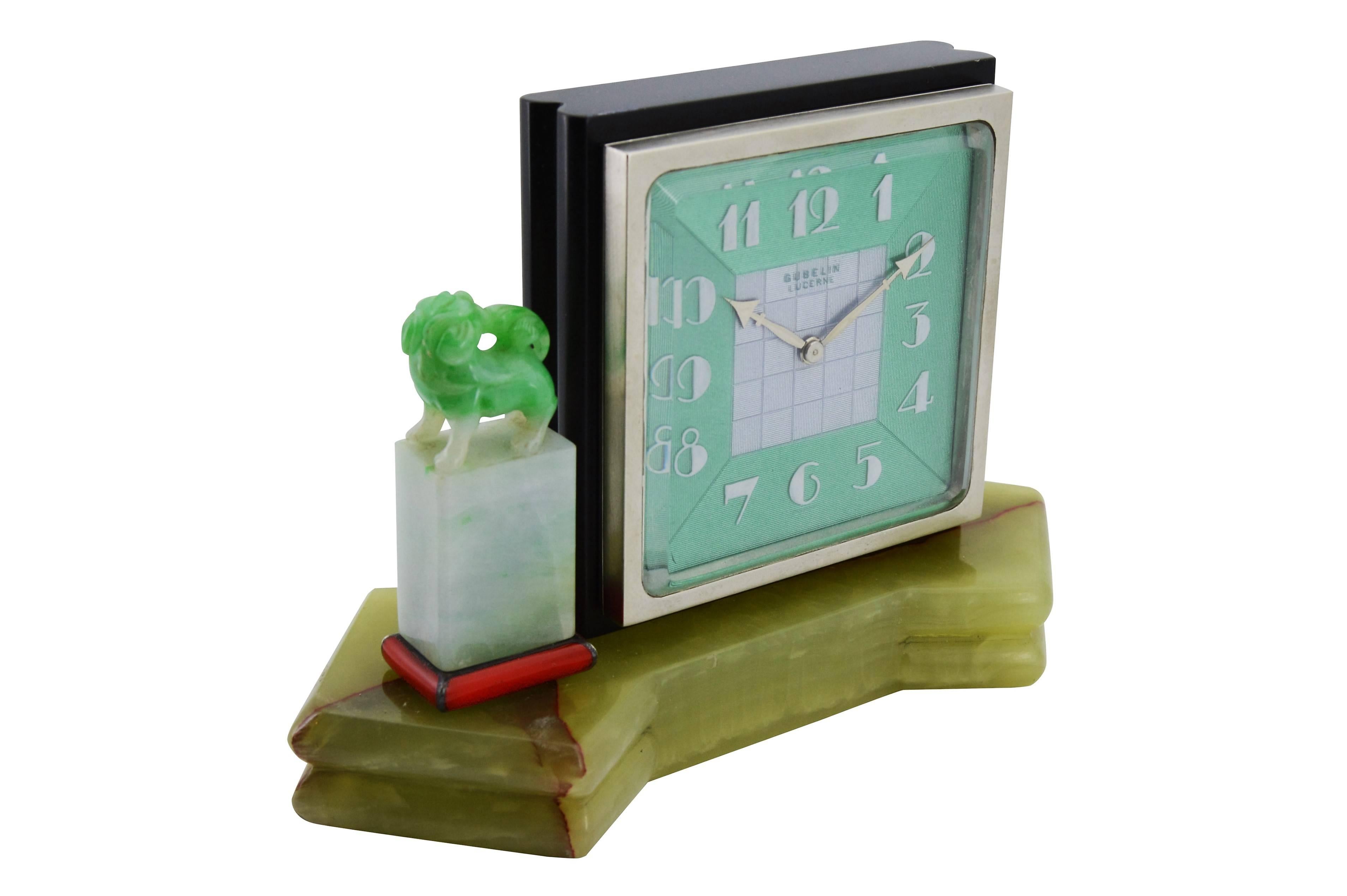 FACTORY / HOUSE: E. Gubelin, Lucerne Switzerland
STYLE / REFERENCE: Art Deco, Desk Clock
METAL / MATERIAL:
CIRCA / YEAR:
DIMENSIONS: Length 5.75 Inches (14cm) long x Diameter 4 inches (10cm) Tall x 2.25 Inches (6cm) Deep
MOVEMENT / CALIBER: 8 Day,