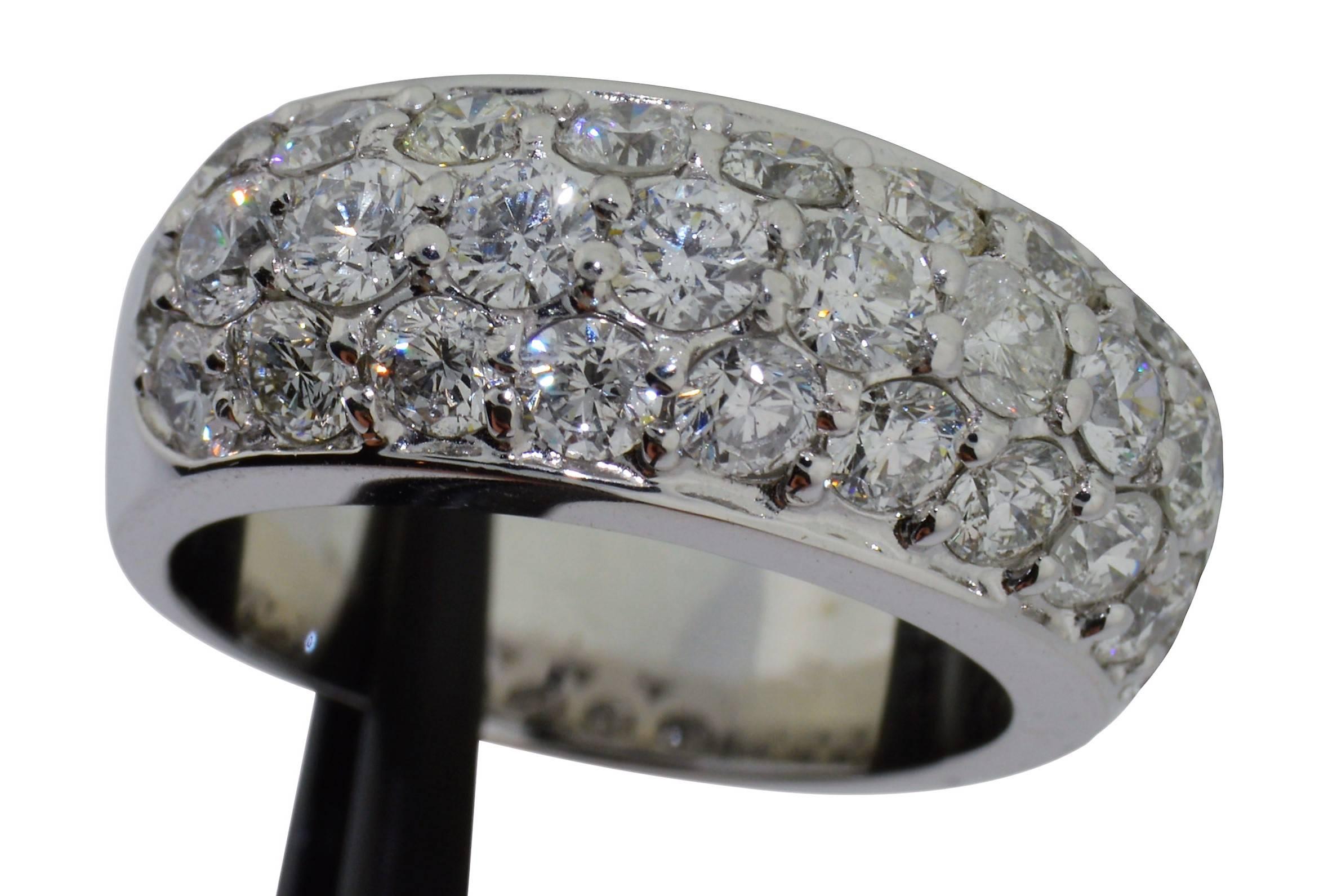Expertly crafted in platinum, this classic, gently domed, pave' diamond ring is a real sparkler. The entire top of this ring is encrusted with 3.00cts of high quality,  round brilliant cut diamonds VS/SI clarity, E/F color. The clean lines of this