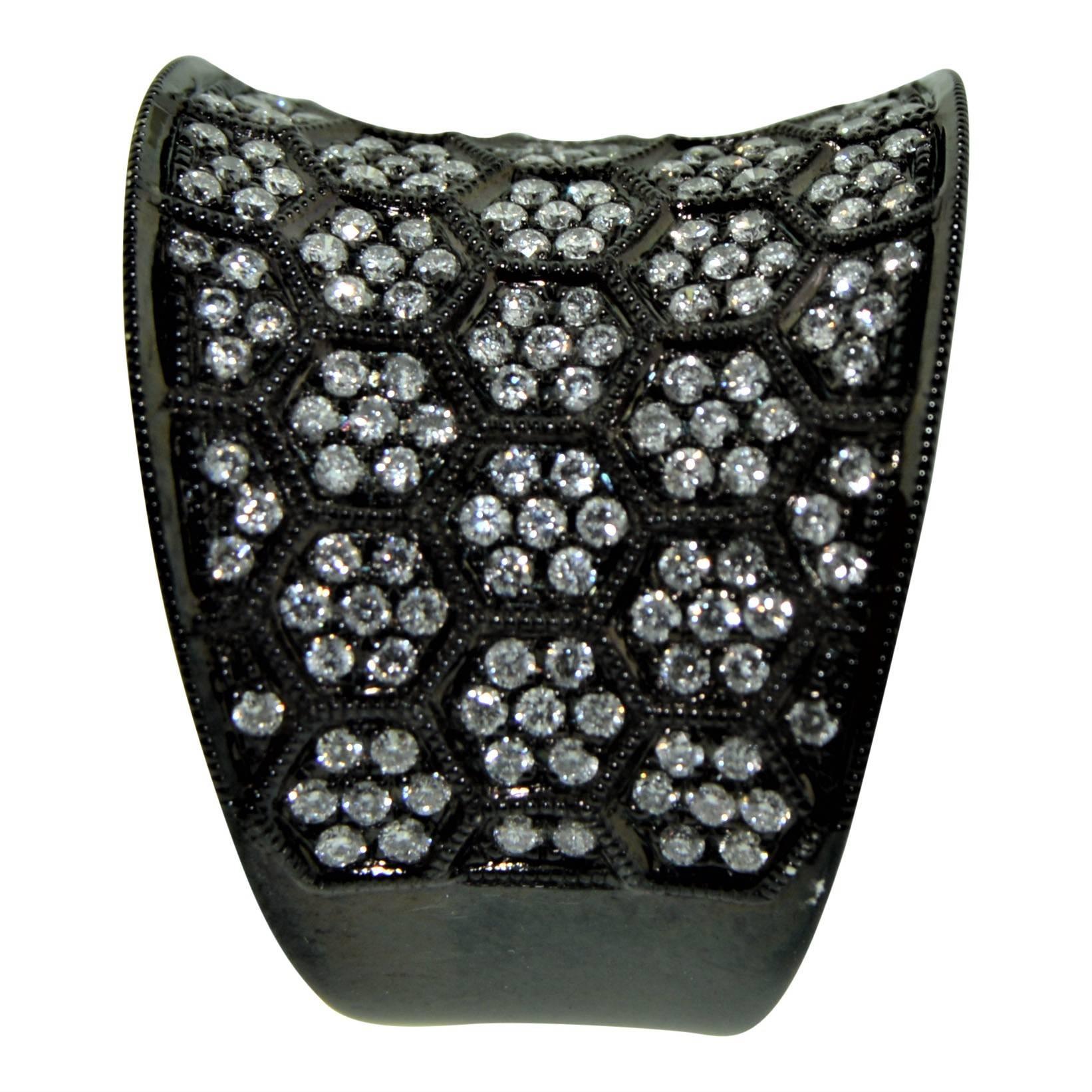 This rich and vibrant, oversized, concave band is just fun! Beautifully made of 18K white gold with a charcoal color anodized finish, is adorned by tiny diamond clusters totaling 1.50cts, flush set within a honeycomb pattern detailed by a fine