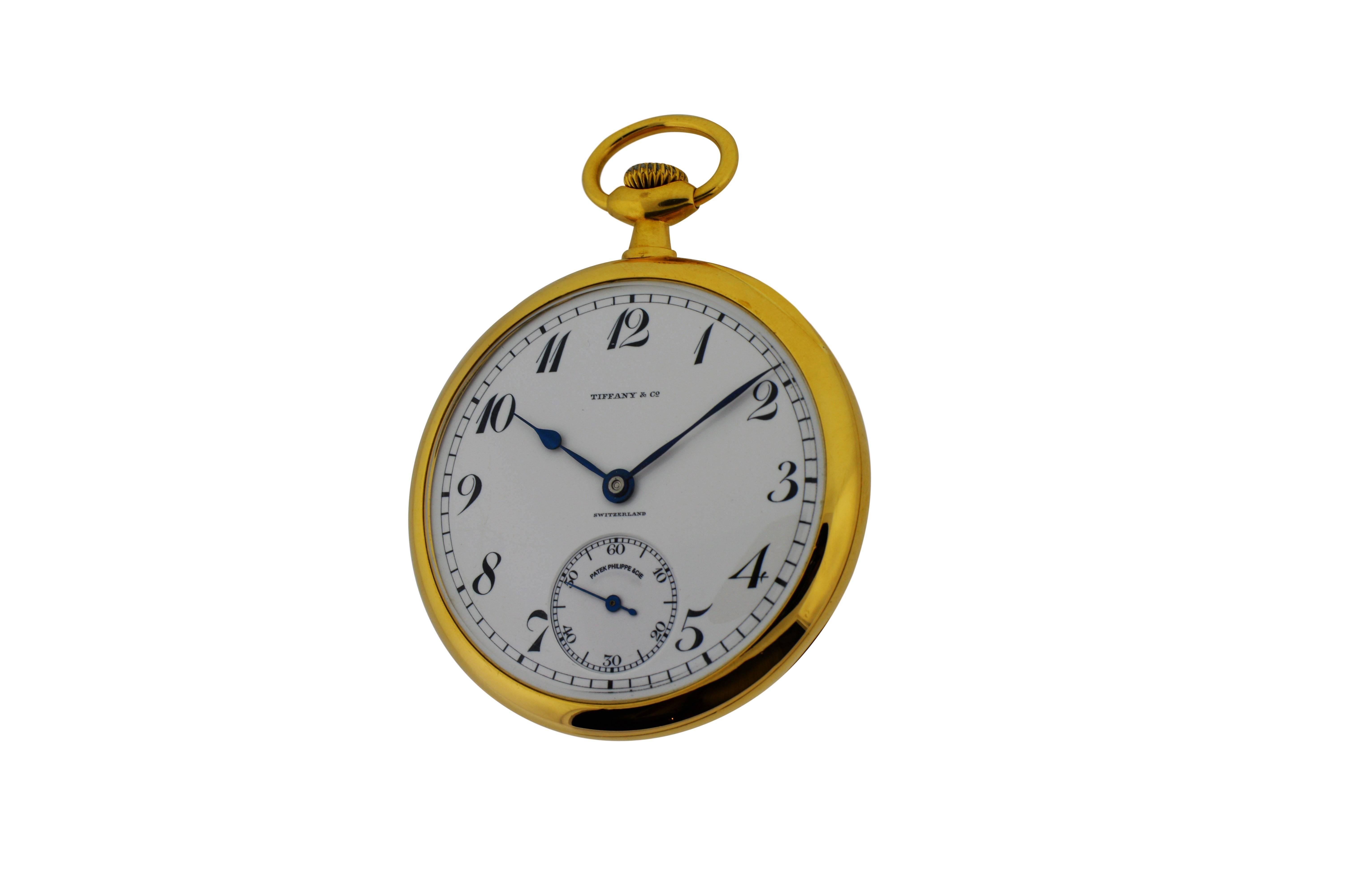 FACTORY / HOUSE: Patek Philippe for Tiffany & Co.
STYLE / REFERENCE: Open Faced Pocket Watch
METAL / MATERIAL: 18Kt. Yellow Gold
CIRCA: 1918
DIMENSIONS:  47mm Diameter
MOVEMENT / CALIBER: 18 Jewels Manual Winding
DIAL / HANDS: Original