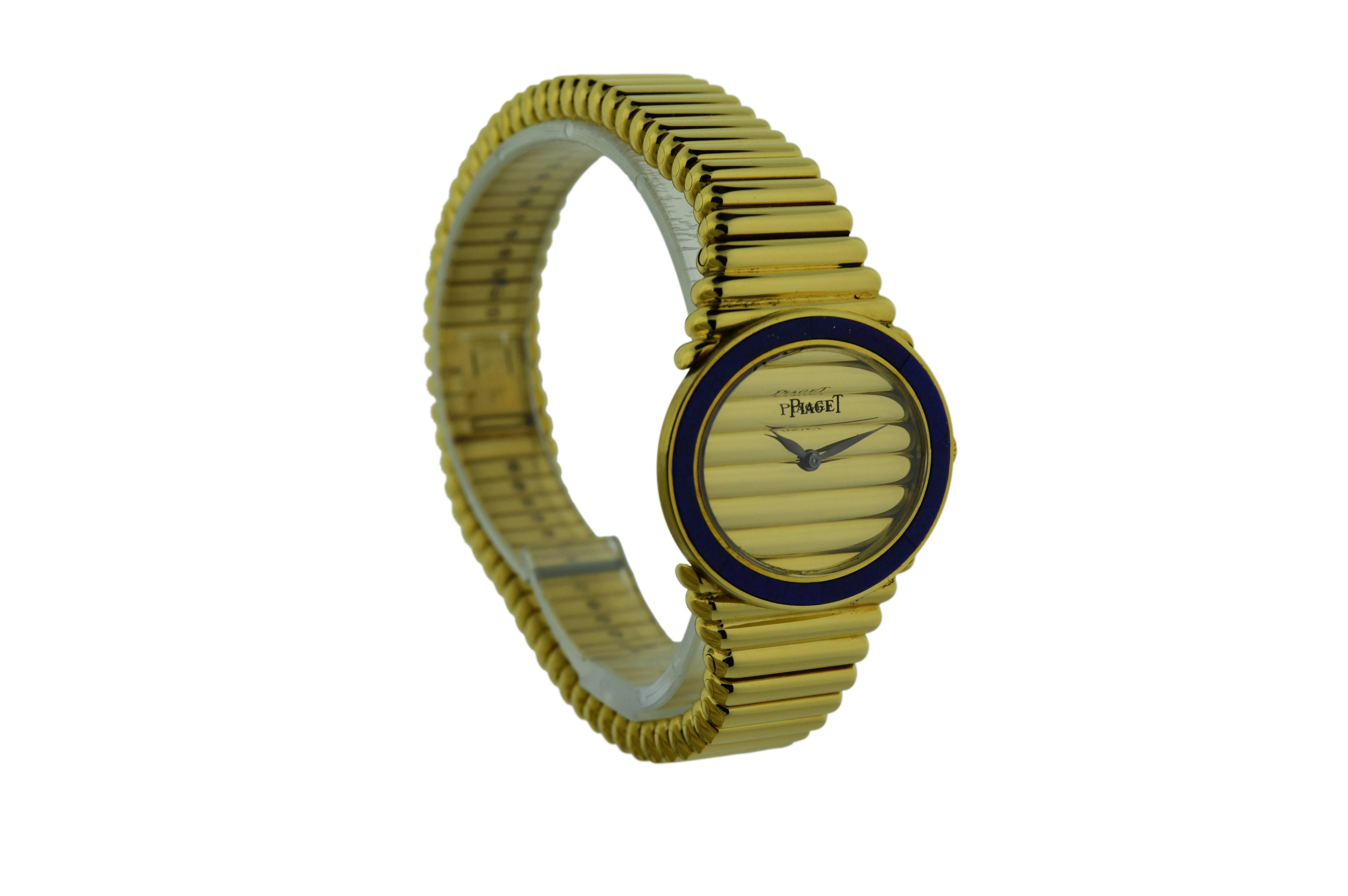 FACTORY / HOUSE: Piaget Watch Company
STYLE / REFERENCE: Gold Bracelet Watch / Lapis Lazuli  / Ref. 264486
METAL / MATERIAL: 18Kt. Yellow Gold 
DIMENSIONS: 24mm  X  27mm
CIRCA: 1970's
MOVEMENT / CALIBER: 17 Jewels / Cal. 9D
DIAL / HANDS: Original,