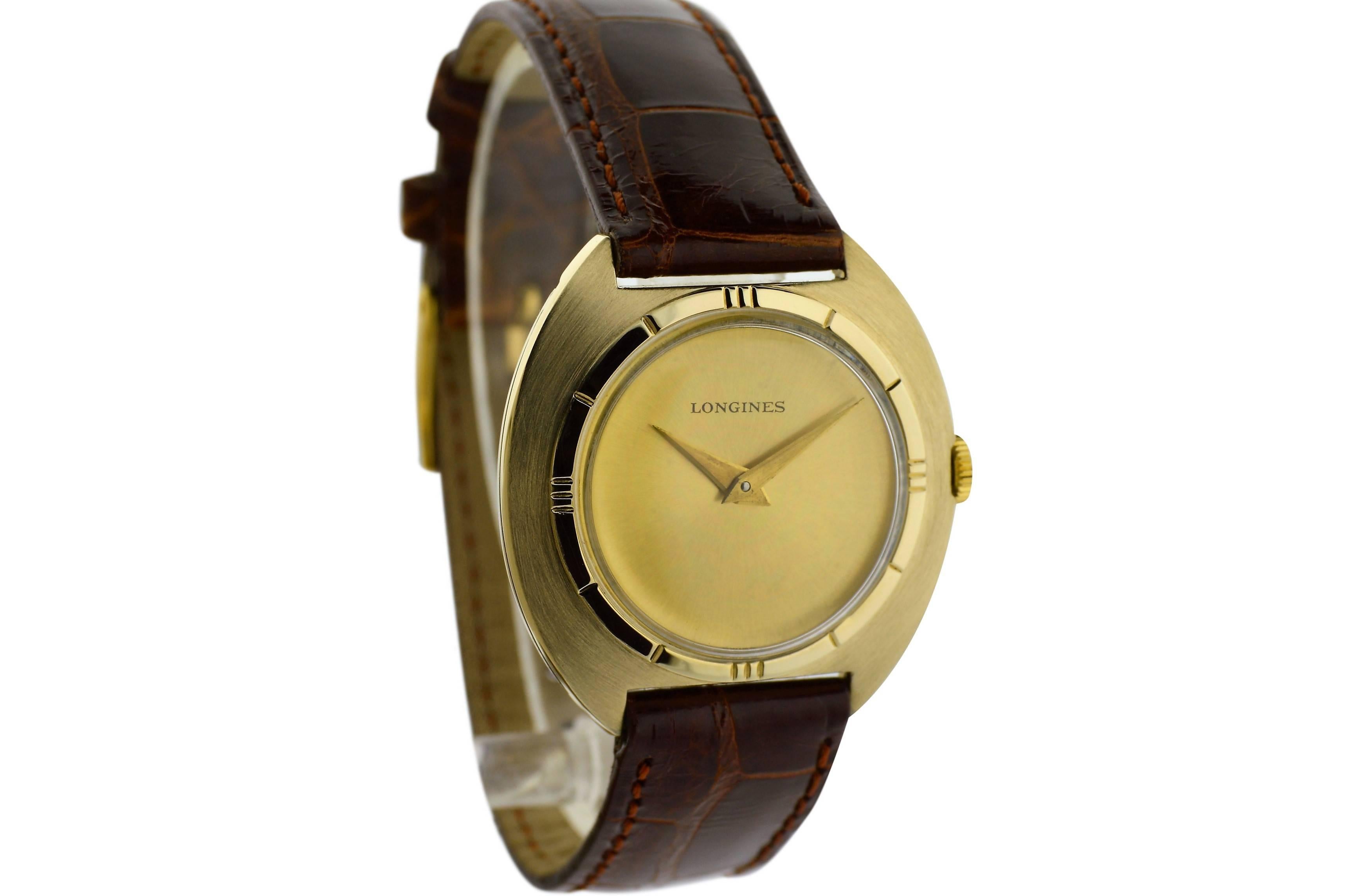 FACTORY / HOUSE: Longines Watch Company
STYLE / REFERENCE: Tonneau Shape
METAL / MATERIAL: Yellow Gold Filled
DIMENSIONS:  34mm  X  33mm
CIRCA: 1960's
MOVEMENT / CALIBER: Winding / Jewels / 370 Cal. 
DIAL / HANDS: Original Brushed Gold / Dauphine