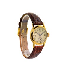 Montre manuelle West End Watch Co. en or jaune Calatrava:: vers 1930