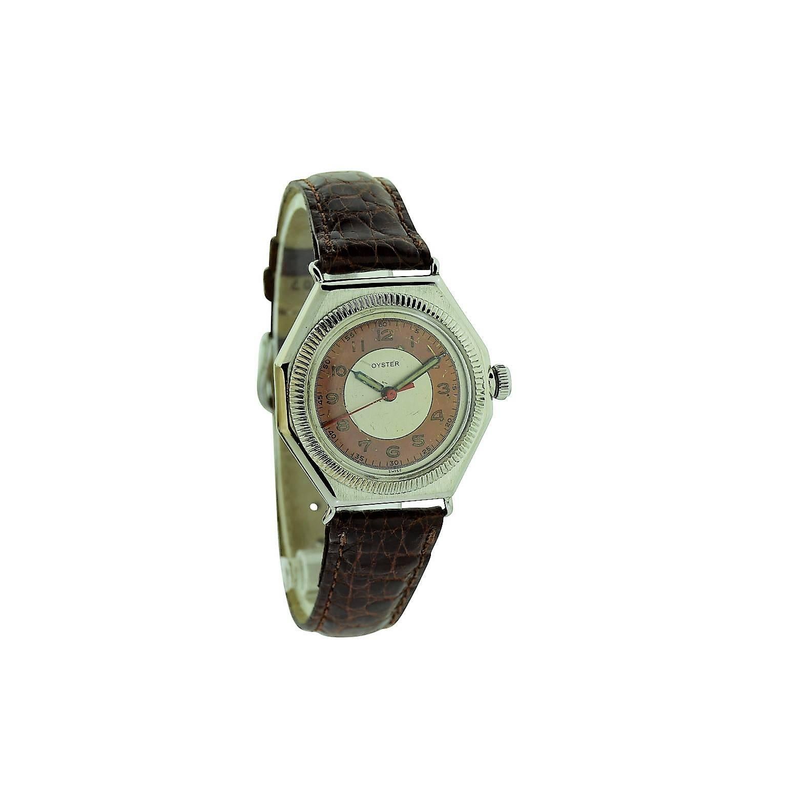 FACTORY / HOUSE: Oyster Watch Company by Rolex
STYLE / REFERENCE: Octagon 
METAL / MATERIAL: Stainless Steel
DIMENSIONS:  39  mm X 32 mm
CIRCA: 1943 / 1944 
MOVEMENT / CALIBER:  Manual Winding / 17 Jewels / Font Caliber
DIAL / HANDS: Two Tone Pink