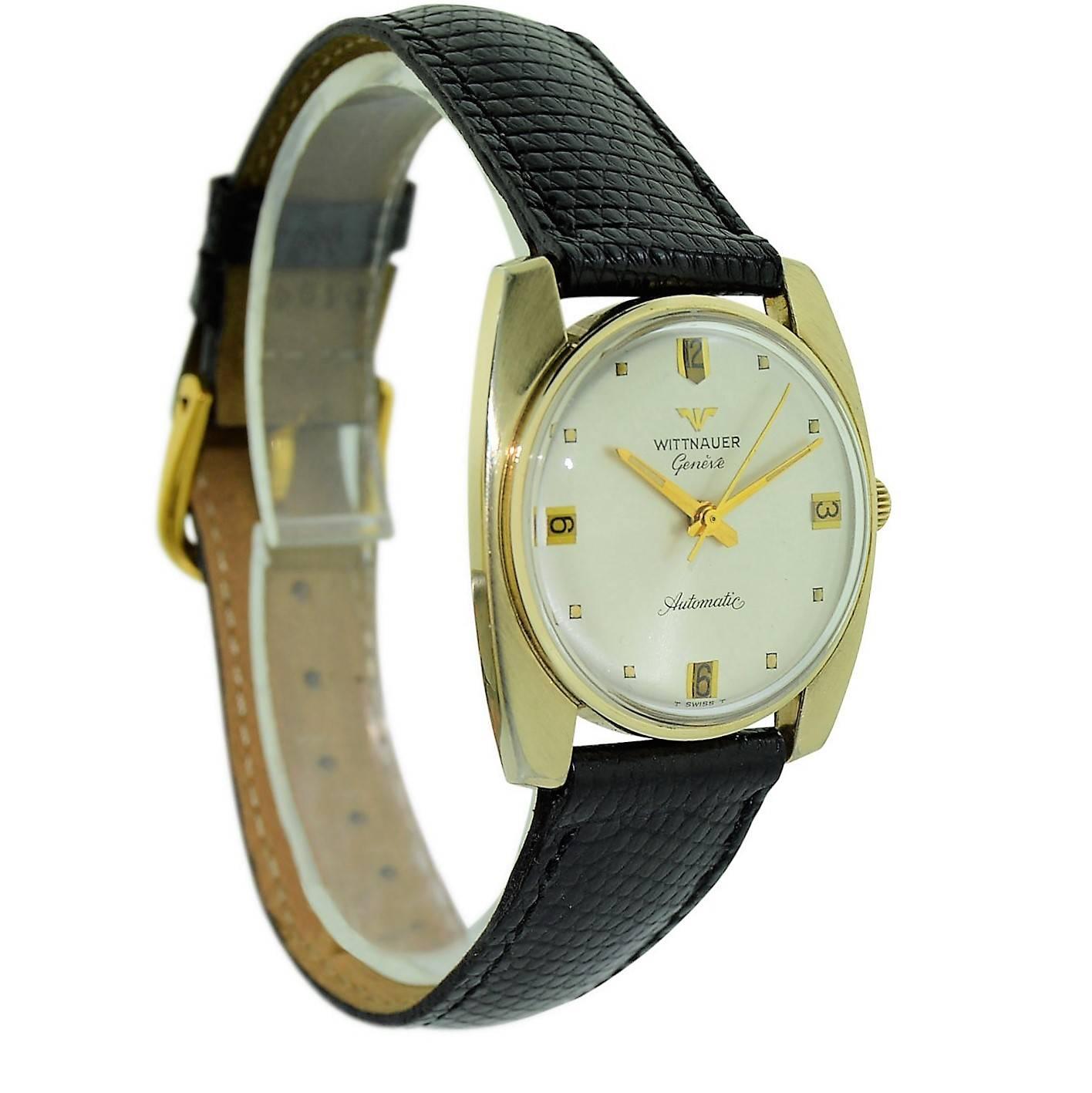 FACTORY / HOUSE:  Wittnauer  Watch Company
STYLE / REFERENCE: Art Deco 
METAL / MATERIAL: 14Kt. Yellow Gold Filled 
DIMENSIONS: 33 mm  X  31 mm
CIRCA: 1960's
MOVEMENT / CALIBER:  Automatic Winding /  17 Jewels / Cal. 911 Kas
DIAL / HANDS:  Original