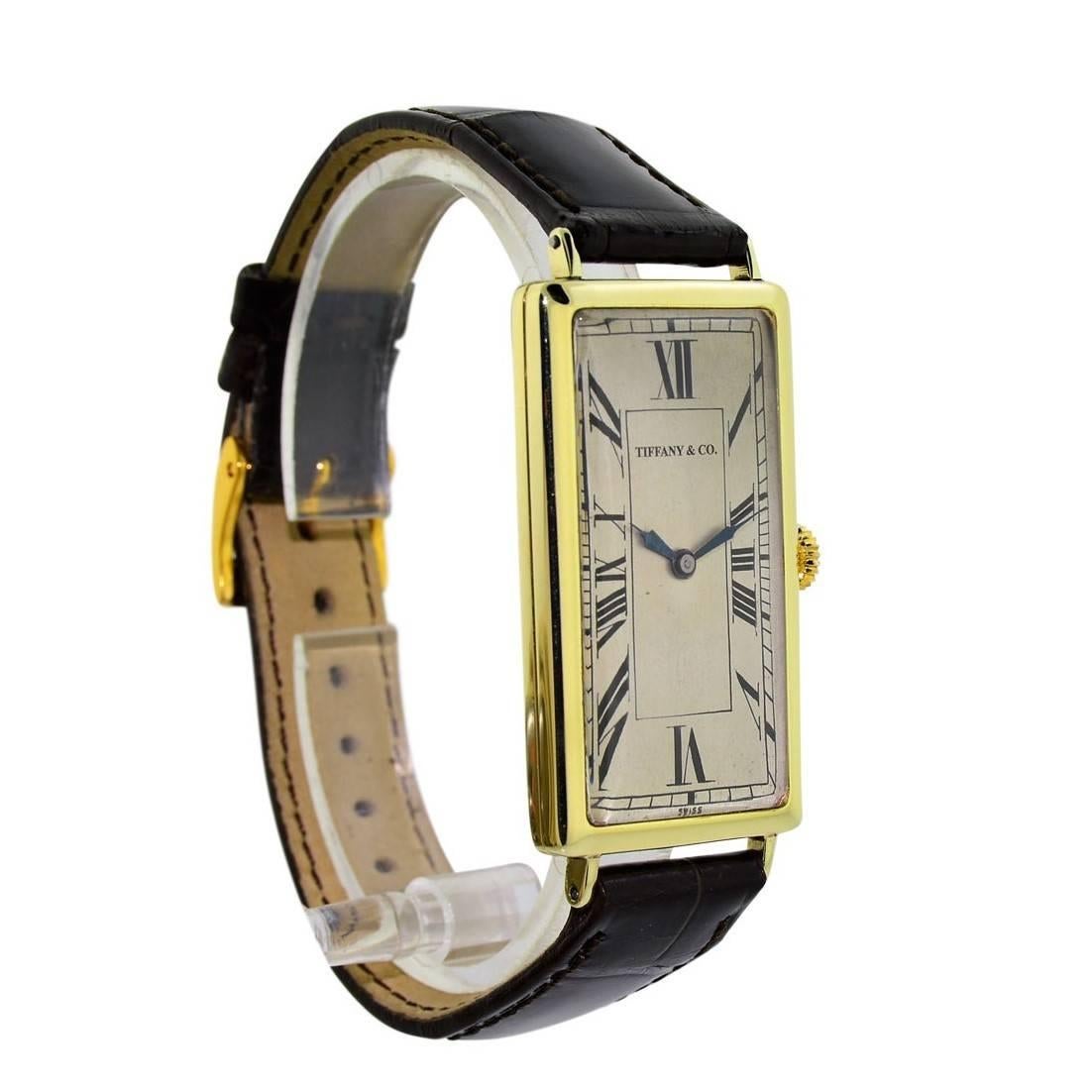 FACTORY / HOUSE: Tiffany and Co. New York
STYLE / REFERENCE: Rectangle /  Art Deco
METAL / MATERIAL:  14 Kt Solid Yellow Gold
CIRCA: 1929
MOVEMENT / CALIBER: Manual Winding / 15 Jewels / cal. 10.86 N
DIAL / HANDS: Original with Kiln Fired Enamel