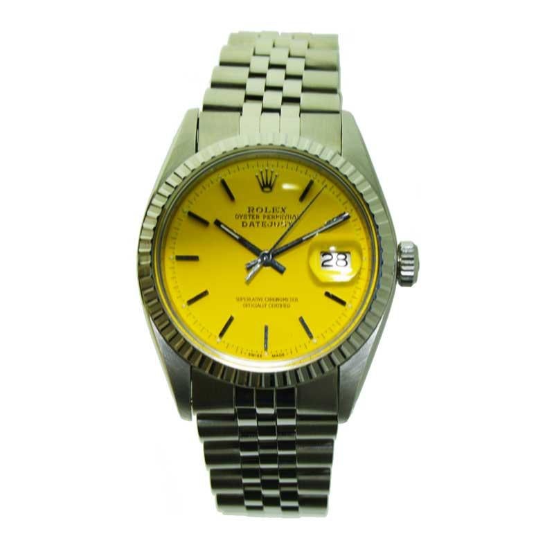 FACTORY / HOUSE: Rolex Watch Company
STYLE / REFERENCE: Datejust / Ref. 1603
METAL / MATERIAL: Stainless Steel 
CIRCA / YEAR: 1978 / 1979 
DIMENSIONS / SIZE: 44mm X 36mm
MOVEMENT / CALIBER: Perpetual Winding / 26 Jewels 
DIAL / HANDS: Custom Yellow