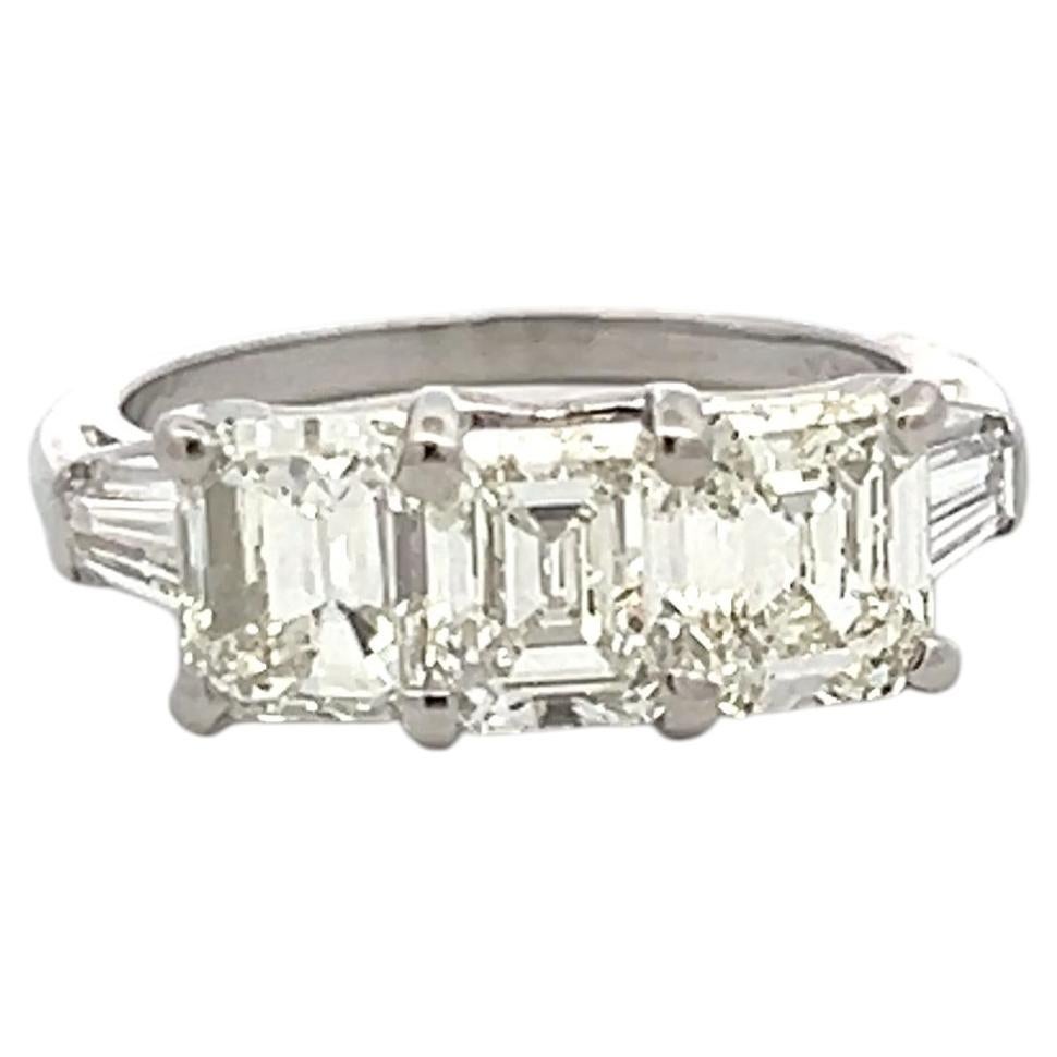 Vintage White Platinum Three-Stone Ring with 2.91 Carat Emerald Cut Diamonds GIA For Sale