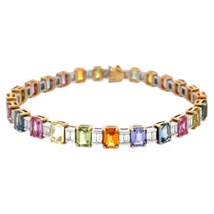 Pulsera tipo tenis de oro bicolor de 18 quilates con un diamante en talla baguette de 3,8 quilates y un zafiro de 20,14 quilates