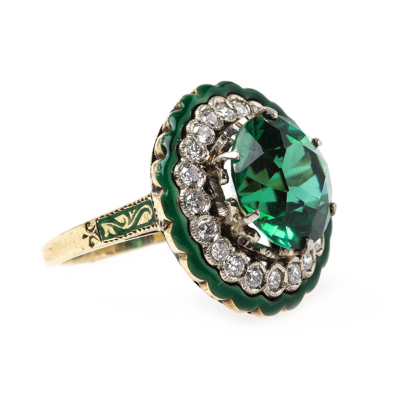 Clifton is an extraordinary authentic Retro era (circa 1940) 14k yellow gold ring centering six-prong set important 5.45cts dark blue-green tourmaline accompanied with a Guild Laboratories certificate. An exquisite halo of twenty-one bezel set