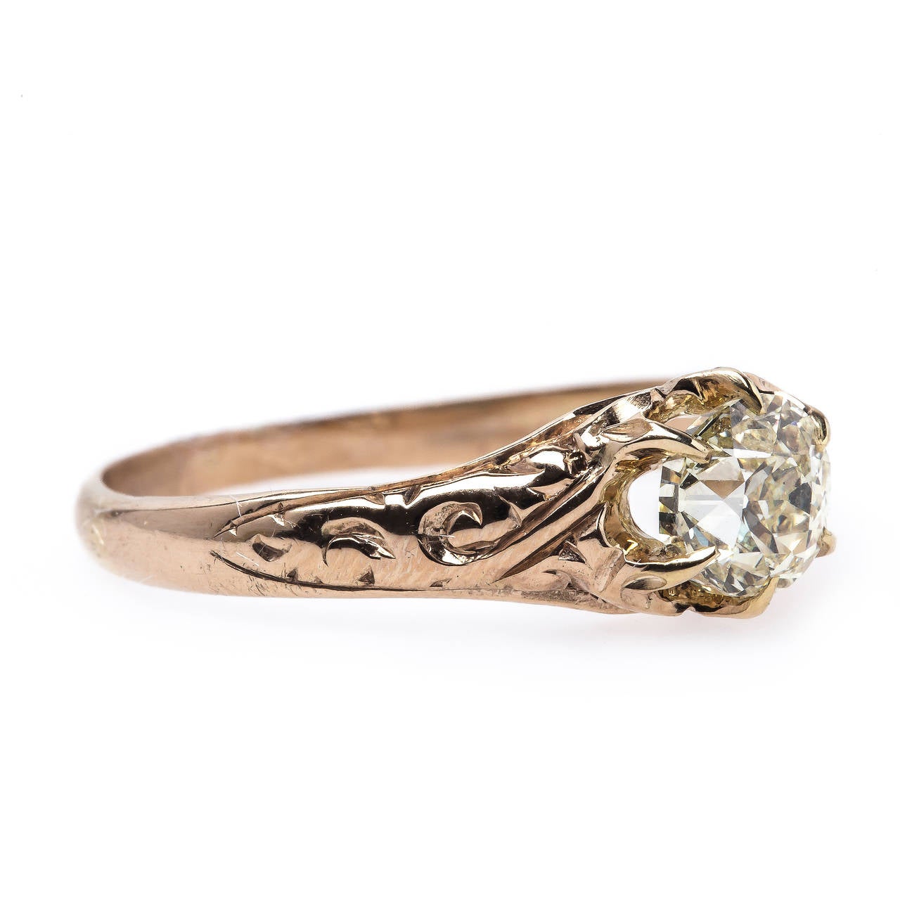 Austell is a lovely, intricate authentic Victorian era (circa 1880) engagement ring made from 14k rose gold centering a 0.67ct EGL Certified Old European Cut diamond graded O-P color and SI1 clarity. The rose gold setting is very unique to our