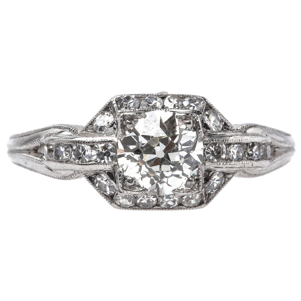 Art Deco Era Platinum Ring with Old European Cut Diamond Center and Diamond Halo