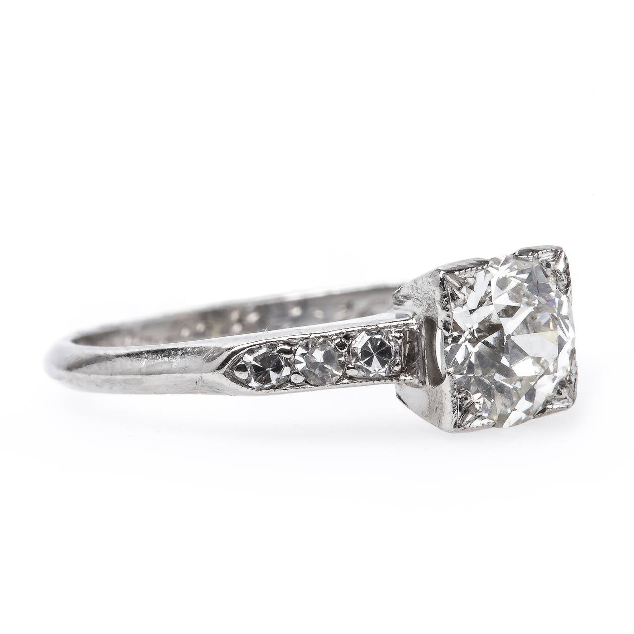 Ridgecrest is a classic authentic Art Deco (engraved 1934) engagement ring made from platinum centering a box-set 0.51ct EGL certified Old European Cut diamond graded I color and VS1 clarity. This classic ring enhances the bright, sparkling center