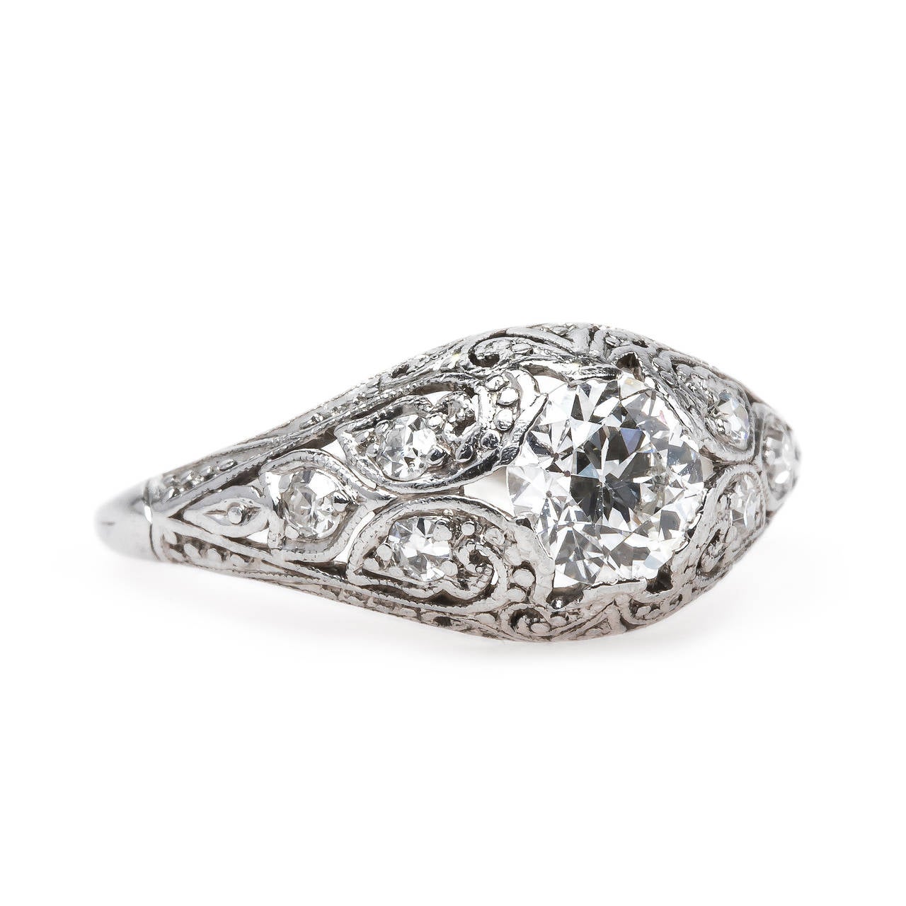 Boca Grande is an exquisitely handcrafted and authentic Edwardian Era engagement ring (circa 1910) made from platinum, featuring a 0.64ct EGL certified Old European Cut diamond, graded F color and VS1 clarity. This stunning engagement ring is